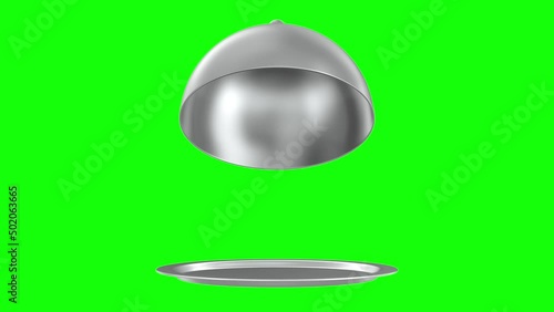 open metallic cloche on green background. Isolated 3d illustration photo