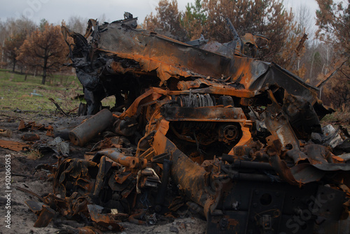 Burnt out military vehicle, after being hit by a shell