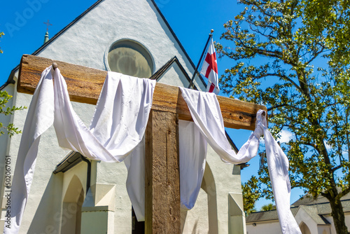 White cloth draped on cross outside church on Easter Sunday