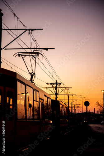 City transport tram lines during the sunset.