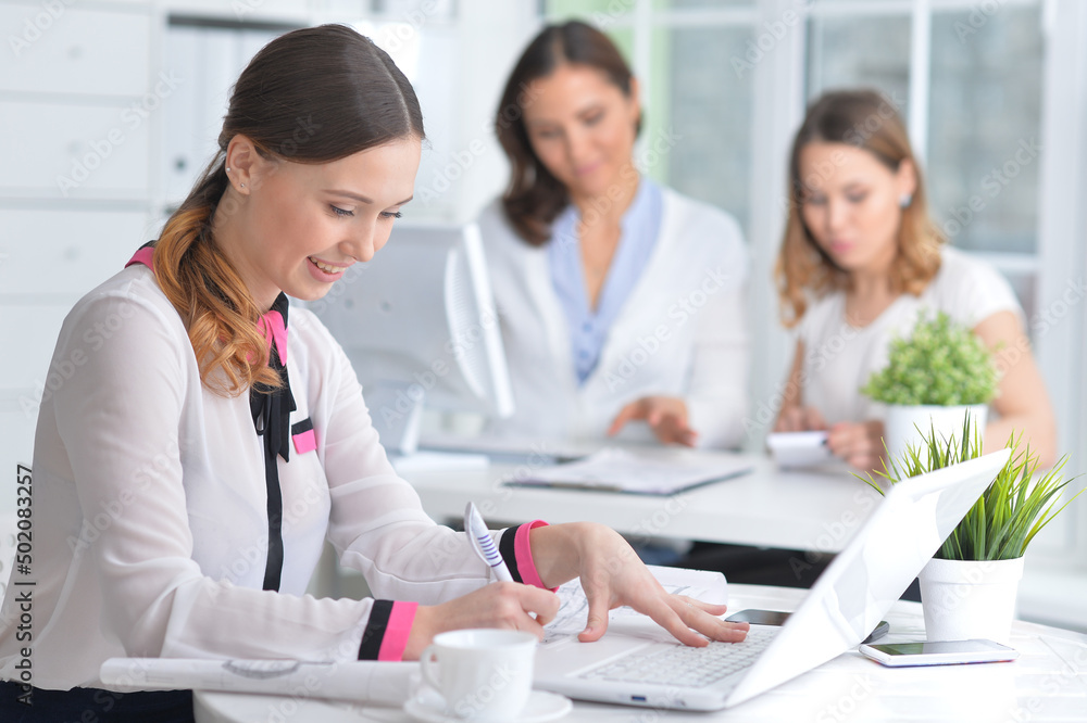 Portrait of young women working in modern office Portrait of young women working in modern office