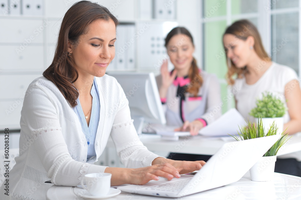 Portrait of young women working in modern office Portrait of young women working in modern office