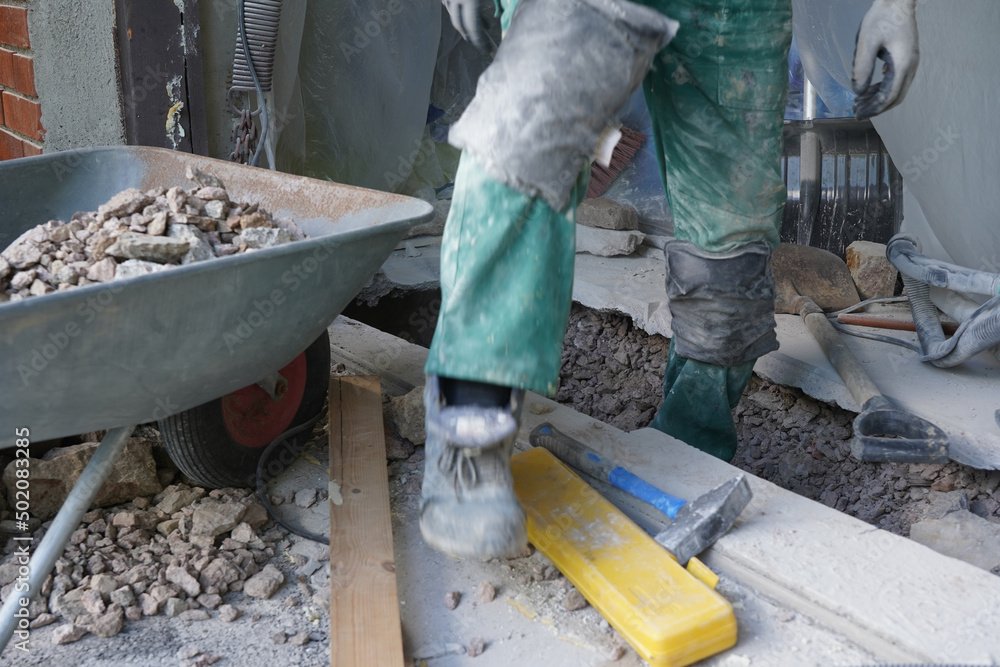 A man taking away crushed stones and betong. A man taking away crushed stones and betong.