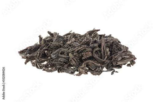 Dry black tea leaves isolated on a white background. Pile of black tea. Large leaf black tea.