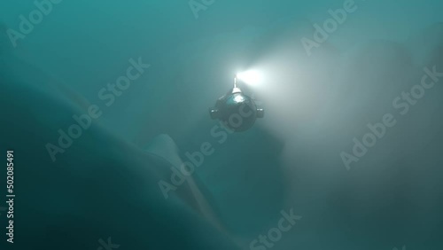 Small bathyscaphe inspects the bottom of the sea with light 3d animation marine background