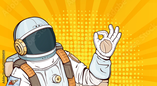 Astronaut in spacesuit showing ok gesture pop art vector illustration. Cosmonaut in helmet, uniform costume for space exploration and flight in cosmos gesturing okay sign on yellow halftone background