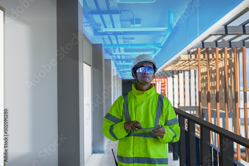 Construction Civil Engineer wearing technology goggles and use software connect with tablets scan buildings and inspections to show augmented virtual reality in work, Building information model, BIM