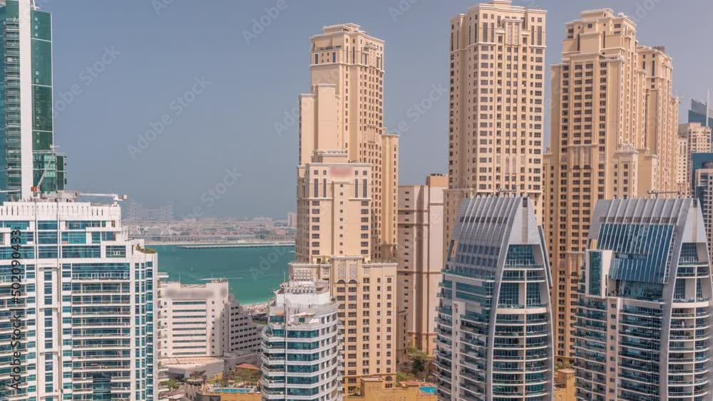 Dubai Marina skyscrapers and JBR district with luxury buildings and resorts aerial timelapse Dubai Marina skyscrapers and JBR district with luxury buildings and resorts aerial timelapse
