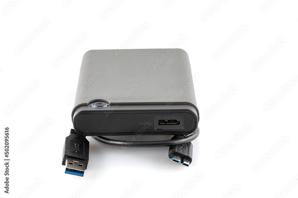 External hard drive disc with usb 3.0 cable, black. Best way of data storage on portable hdd. Close-up side left view isolated on white background. Full depth of field. External hard drive disc with usb 3.0 cable, black. Best way of data storage on portable hdd. Close-up side left view isolated on white background. Full depth of field.