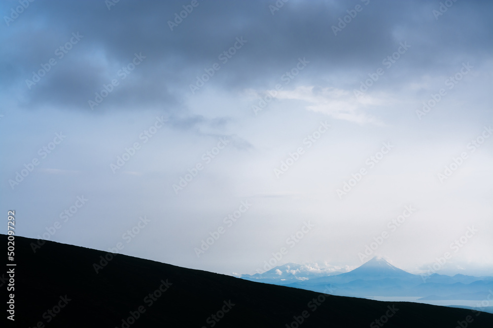 Obraz premium Vilyuchinsky volcano in Kamchatka from the far distance in the evening