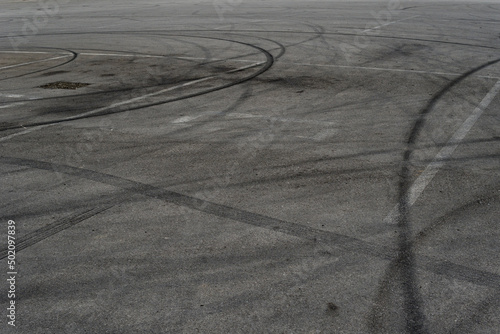 Wallpaper Mural Asphalt texture with white line and tire marks. Smooth asphalt road. Tarmac dark grey grainy road background.Top view Torontodigital.ca