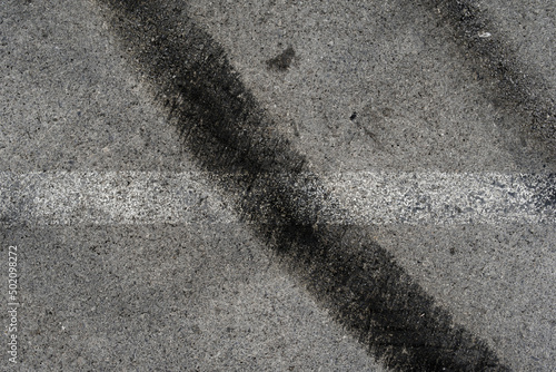 Wallpaper Mural Asphalt texture with white line and tire marks. Smooth asphalt road. Tarmac dark grey grainy road background.Top view Torontodigital.ca