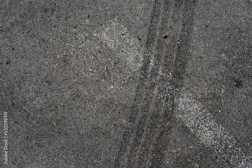 Wallpaper Mural Asphalt texture with white line and tire marks. Smooth asphalt road. Tarmac dark grey grainy road background.Top view Torontodigital.ca