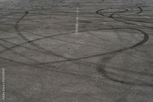 Wallpaper Mural Asphalt texture with white line and tire marks. Smooth asphalt road. Tarmac dark grey grainy road background.Top view Torontodigital.ca