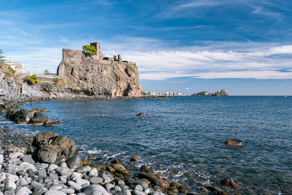 The norman castle of Acicastello, near Catania, built on a lava cliff on the sea. Sicily, Italy.