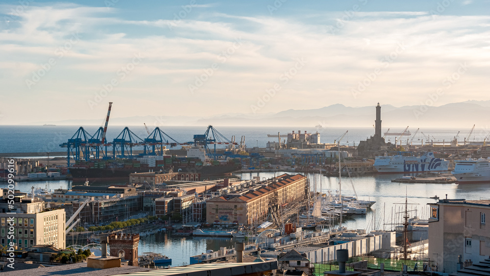 Panoramic view of the harbor of Genoa with Lanterna lighthouse in the background. Liguria, Italy