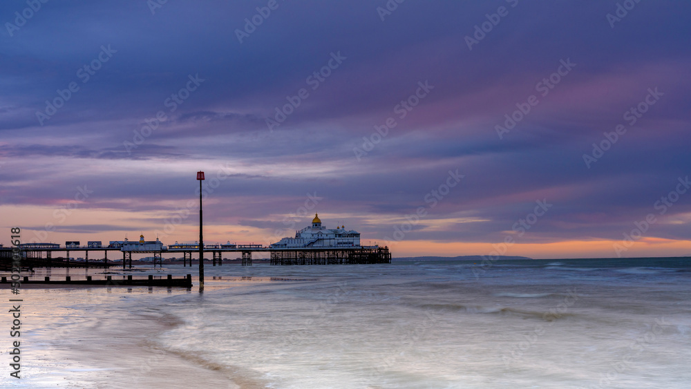 Mid-winter sunrsie on Eastbourne Pier, East Sussex, UK