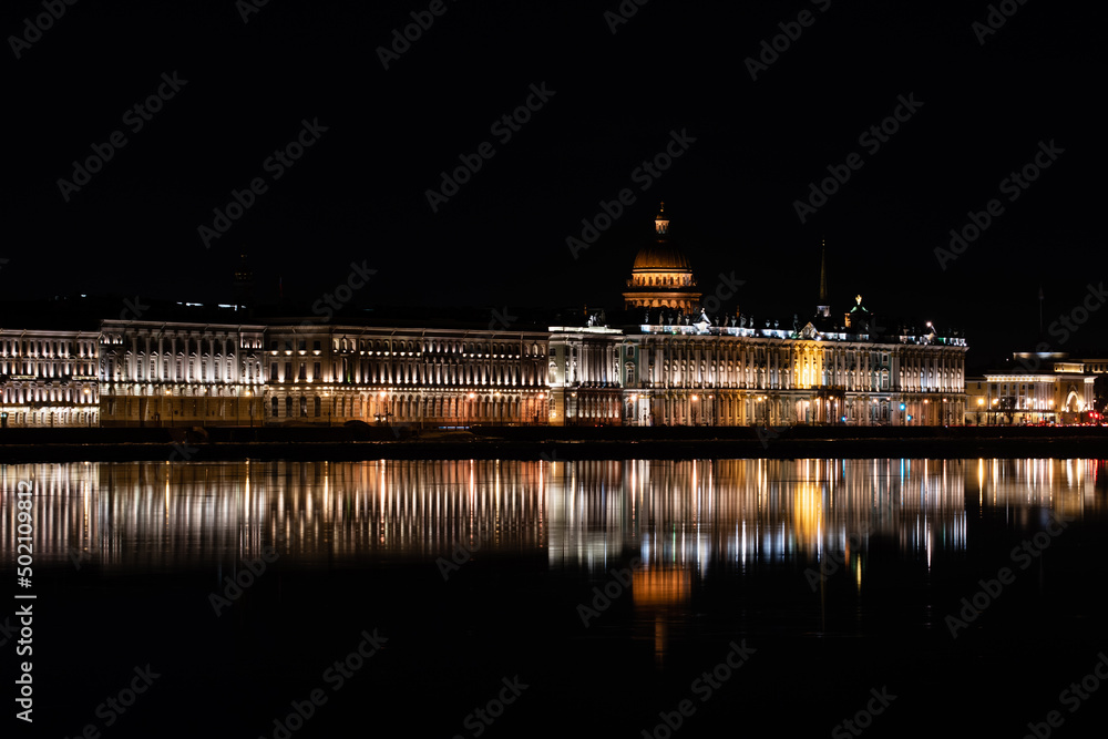 Night city view with reflection in water