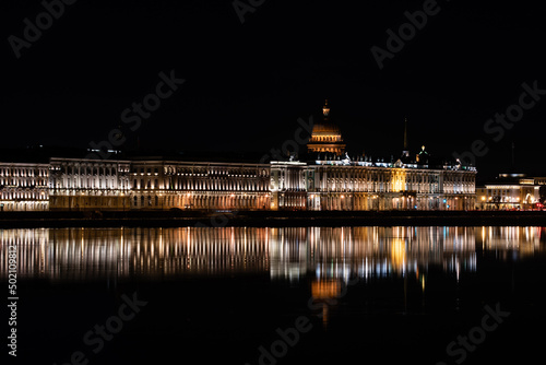 Night city view with reflection in water