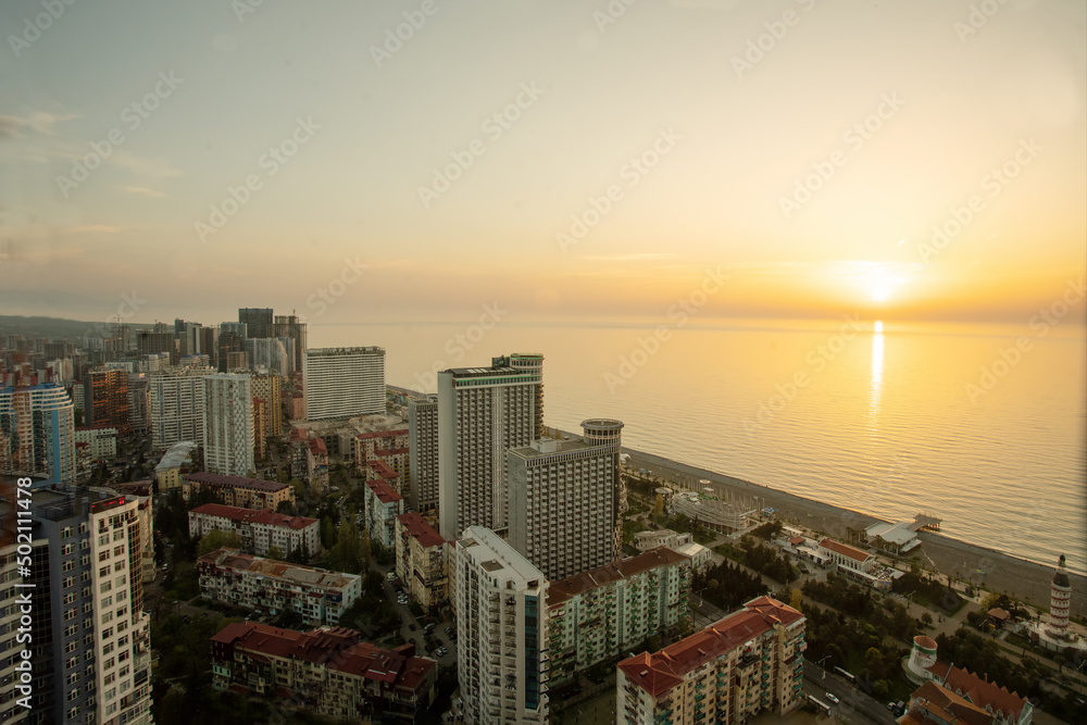 Black sea coast in Batmu - idyllic view from skyscraper to water and high and low building - sunset!