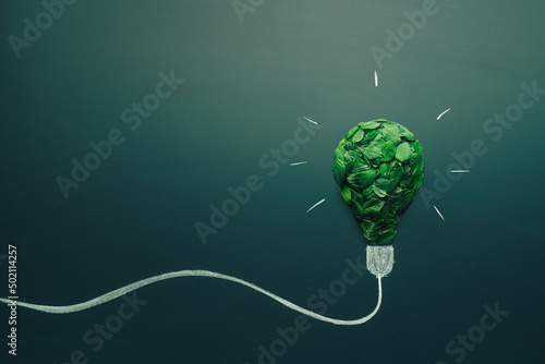 energy saving light bulb made with green leaves. Minimal nature concept. Think green. Ecology concept. Environmentally friendly planet. Copy space