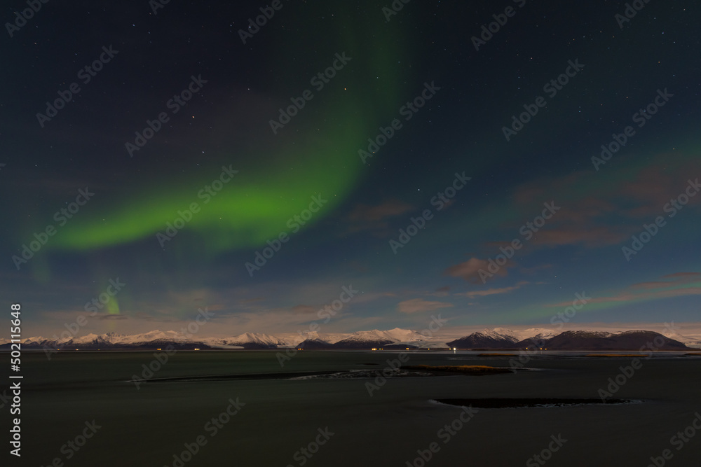 Beautiful northern lights in the wonderful evening of South Iceland