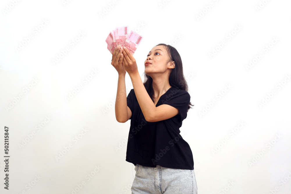 Excited Asian Young Woman Holding Money. Isolated on white background Excited Asian Young Woman Holding Money. Isolated on white background