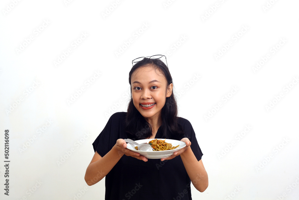 Asian young woman holding a plate of noodle. Isolated on white background Asian young woman holding a plate of noodle. Isolated on white background