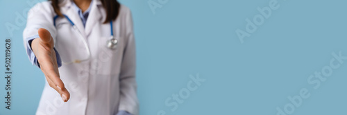 Female doctor giving hand f...