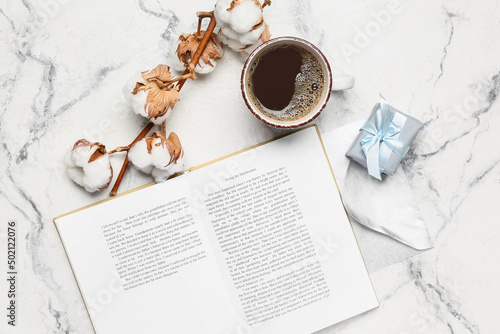 Opened book, cup of coffee ...