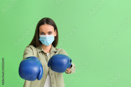 Young woman in medical mask...