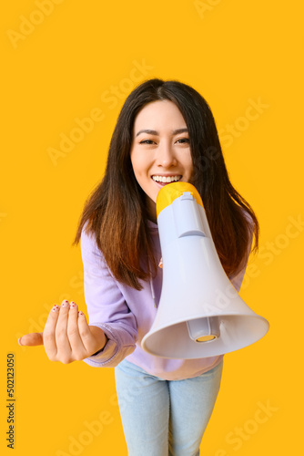 Young Asian woman with mega...