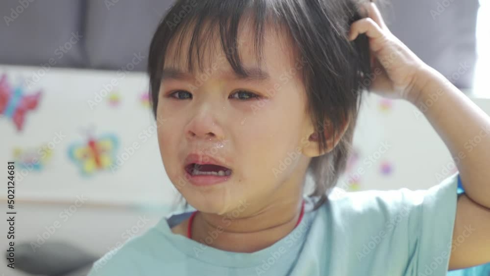 Baby boy was crying and calling his mother on the bed in the bedroom. Baby boy was crying and calling his mother on the bed in the bedroom.