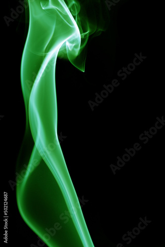 Green smoke on black background