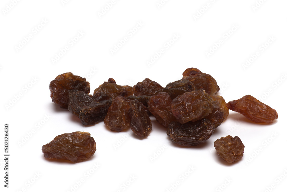Closeup pile dried shriveled raisins white background Closeup pile dried shriveled raisins white background