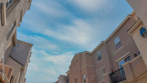 Panorama Whispy white clouds Low angle view of an apartment buildings across each other at Sa