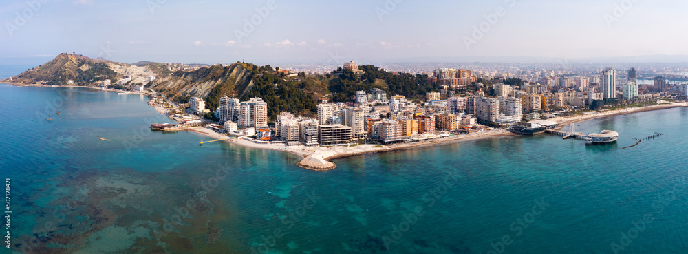 Scenic panoramic aerial view of Durres cityscape on Albanian Adriatic coast with wide landscaped beach promenade along seashore and Royal Villa  - obrazy, fototapety, plakaty 