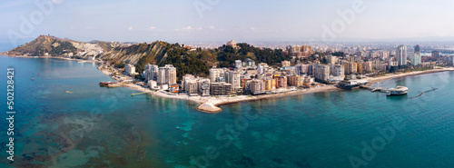 Scenic panoramic aerial view of Durres cityscape on Albanian Adriatic coast with wide landscaped beach promenade along seashore and Royal Villa 