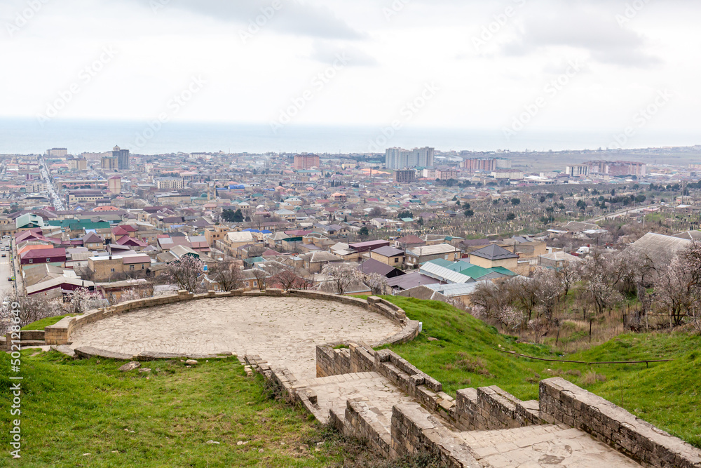 Derbent fortress Naryn Kala is the main touristic attraction in the city. Dagestan, North Caucasus, Russia. the city of Derbent in the distance, the blue sea and the sky.