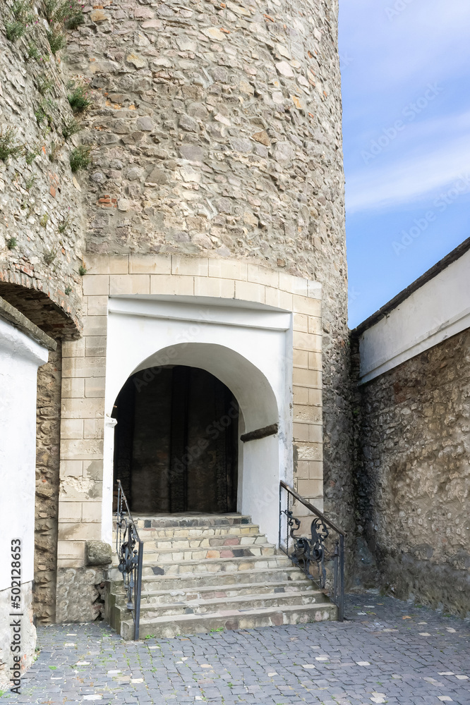 stone staircase in the castle with the entrance to the arch
