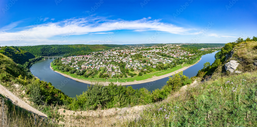 Large panorama. A horseshoe-shaped river bend. meander in a river. Panoramic view from above city Zaleshchiki in the Dnister river, Ukraine
