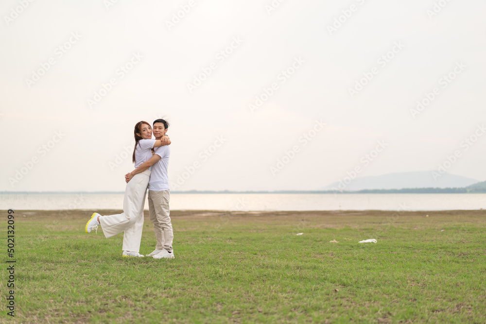 Happy young Asian couple in bride and groom t-shirt Happy young Asian couple in bride and groom t-shirt