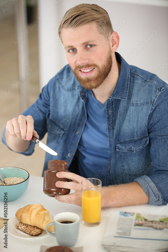 bearded man with breakfast and cup of morning coffee bearded man with breakfast and cup of morning coffee