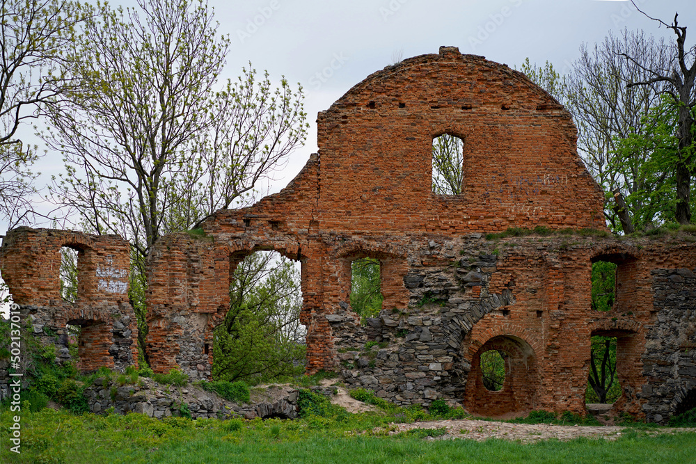 ruins of an ancient castle ukraine. Ruins of expressive red brick gate tower of ancient castle in Korets, Ukraine