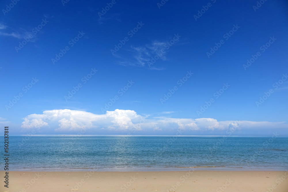 Peaceful seascape background for summer vacation and holidays. Tropical sea beach with blue sky and white clouds background