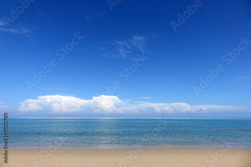 Peaceful seascape background for summer vacation and holidays. Tropical sea beach with blue sky and white clouds background