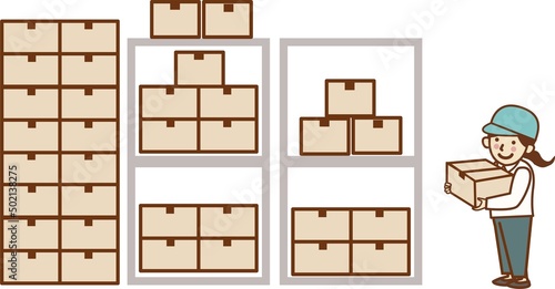 倉庫で段ボールを持つ作業員の女性