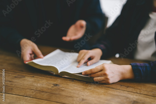 Obraz na plátně Christian friends group reading and study bible together in home or Sunday school at church