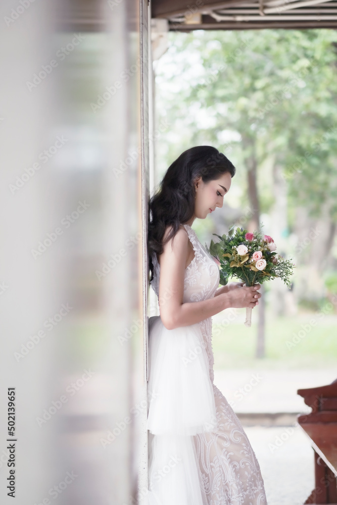 Beautiful tender bride fashion wearing dress in wedding atelier.
Beautiful tender bride fashion wearing dress in wedding atelier.