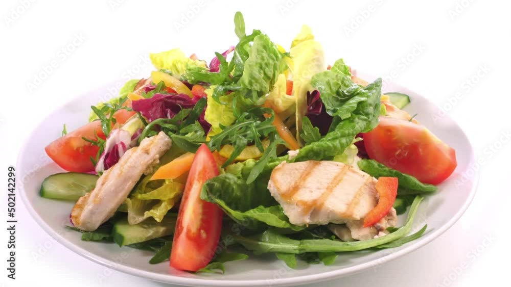 Mixed Salad on a Plate with grilled Chicken isolated on white background Mixed Salad on a Plate with grilled Chicken isolated on white background